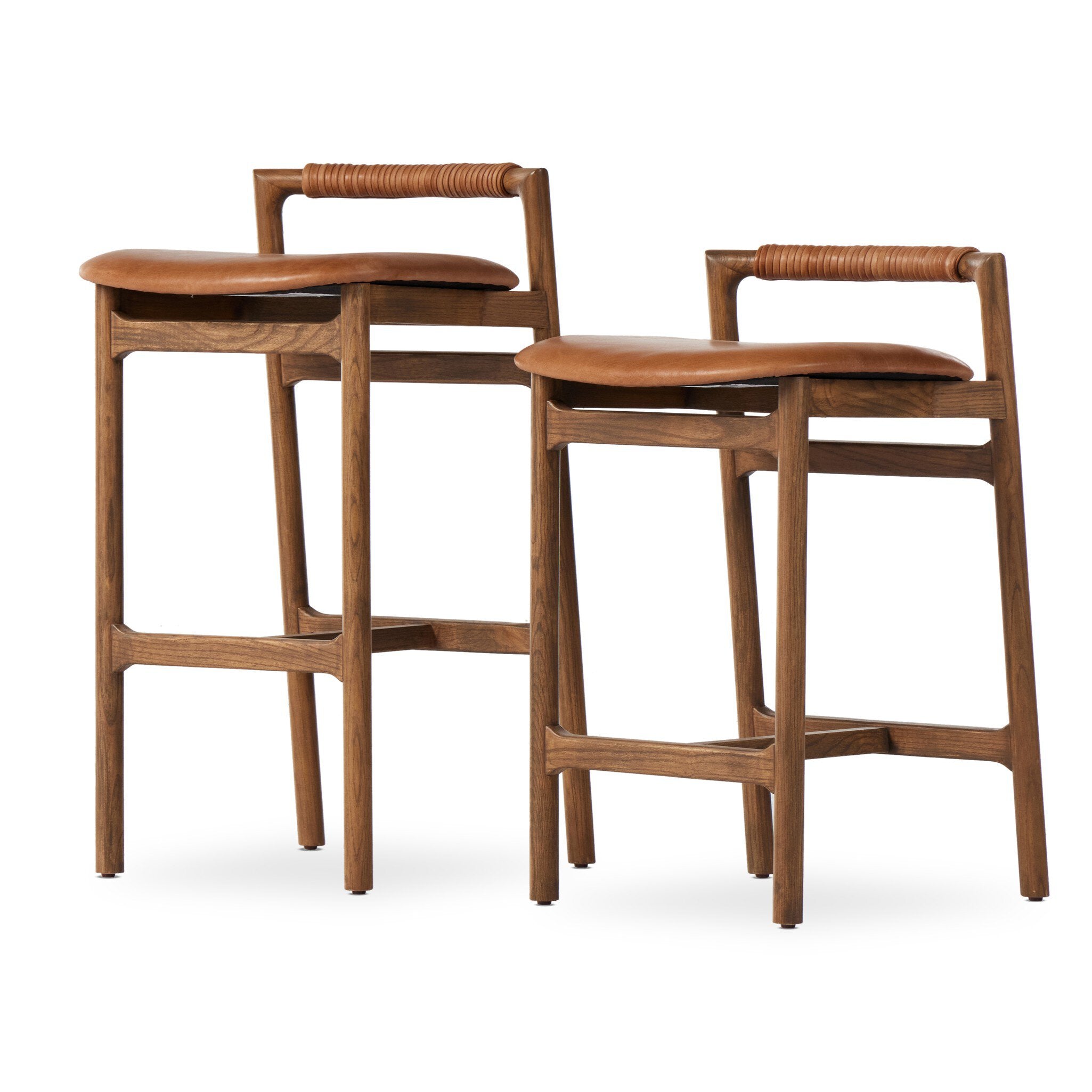 Two wooden Baden Counter Stools in Haven Tobacco top-grain leather with a minimalist backrests on a white background