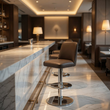 Upholstered bar stool with chrome column and brown seat