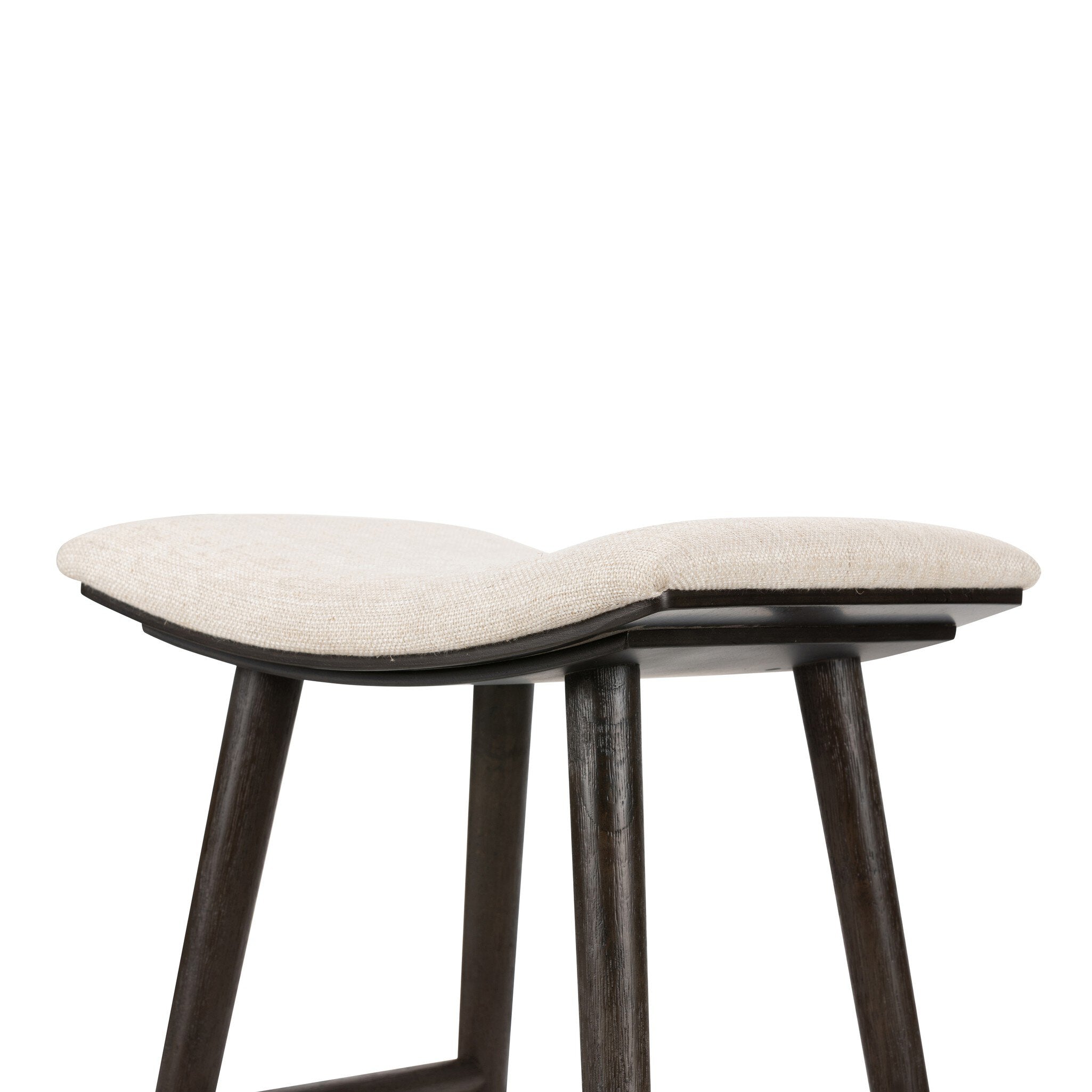 Natural linen counter stool with curved seat and dark wood legs, wide footrest rail