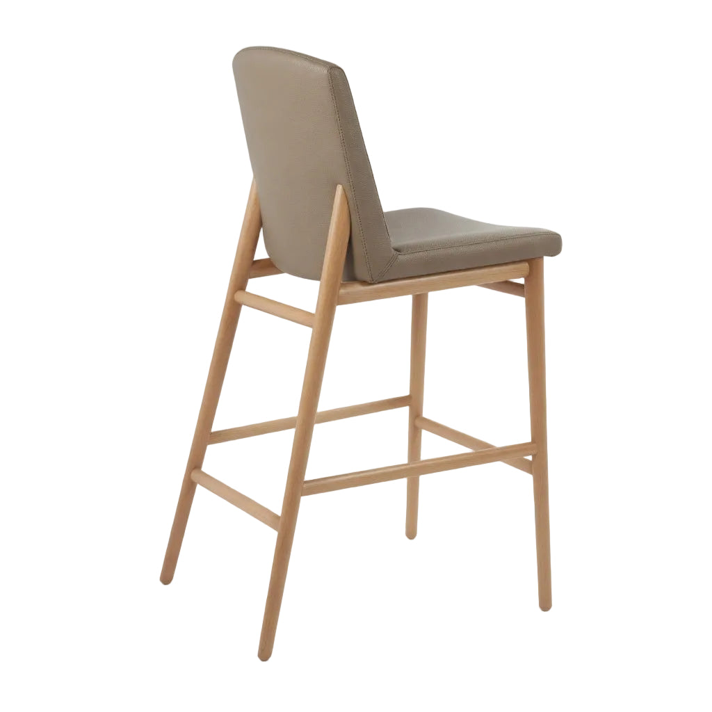 Bar stool with taupe upholstered seat and back, light wood frame with angled legs
