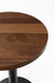 Walnut table top with smooth dark-brown finish and rounded edge detail.