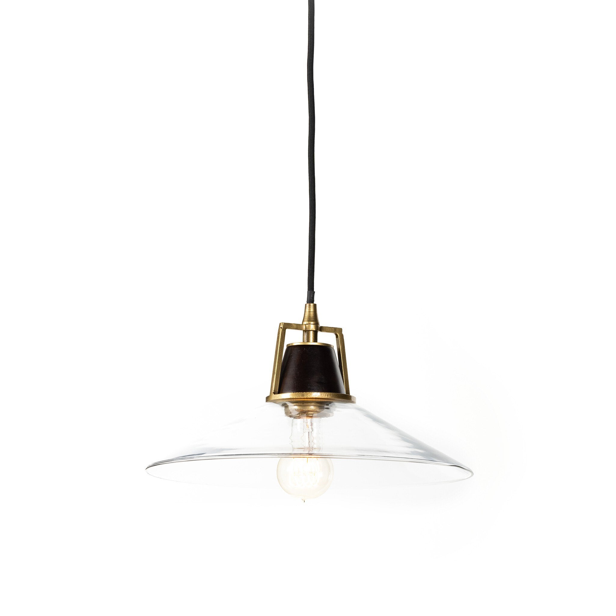 Warmly lit Novak 10-inch hand-hammered antique brass pendant light with clear glass detail 