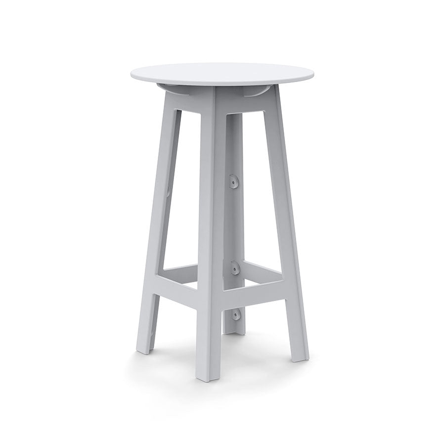White round bar table with angled legs and open-frame cutouts
