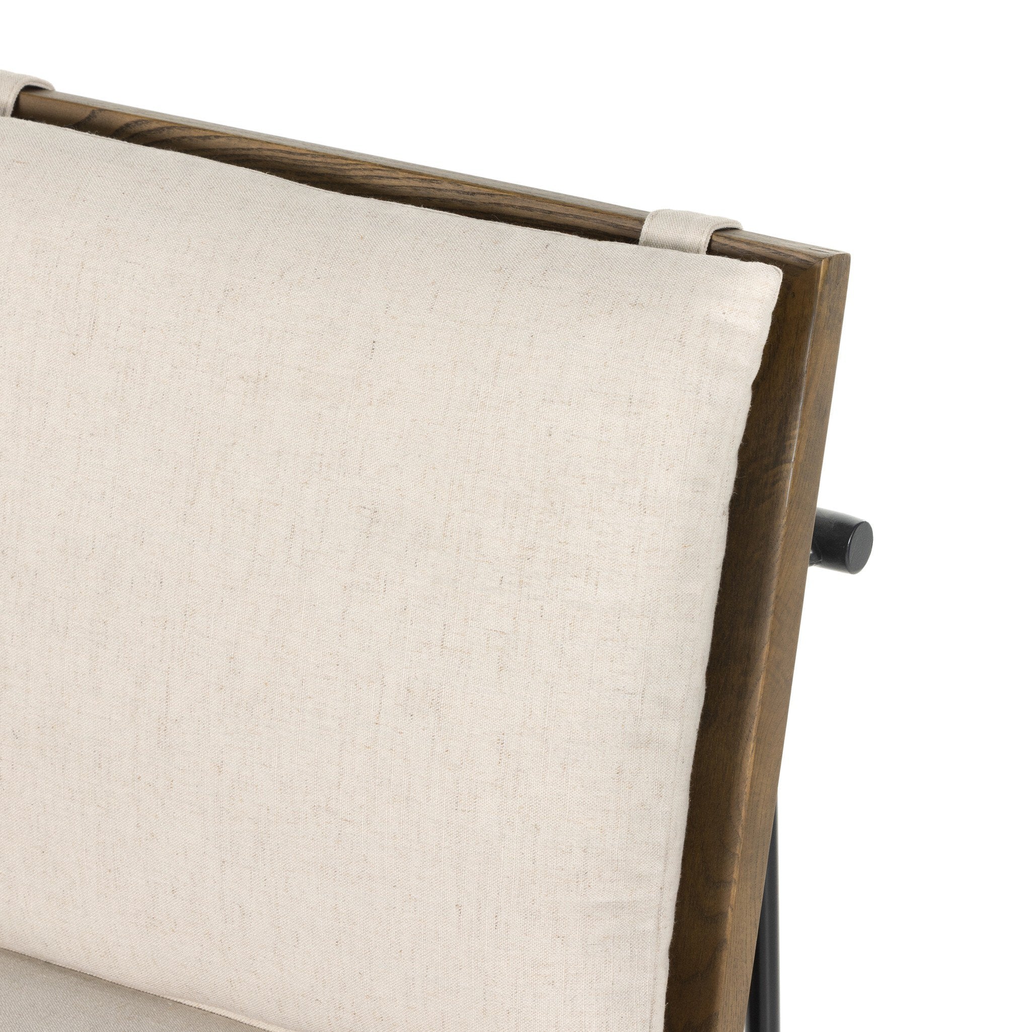 Cream upholstered backrest with fabric texture and dark wood frame detail