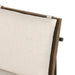 Cream upholstered backrest with fabric texture and dark wood frame detail