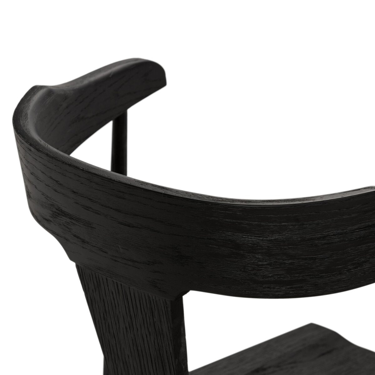 Black oak counter stool curved backrest detail with dark woodgrain finish, close-up