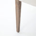 Wooden leg detail Reuben Dining Chair with oak frame, leather-wrapped arms, and natural linen seat