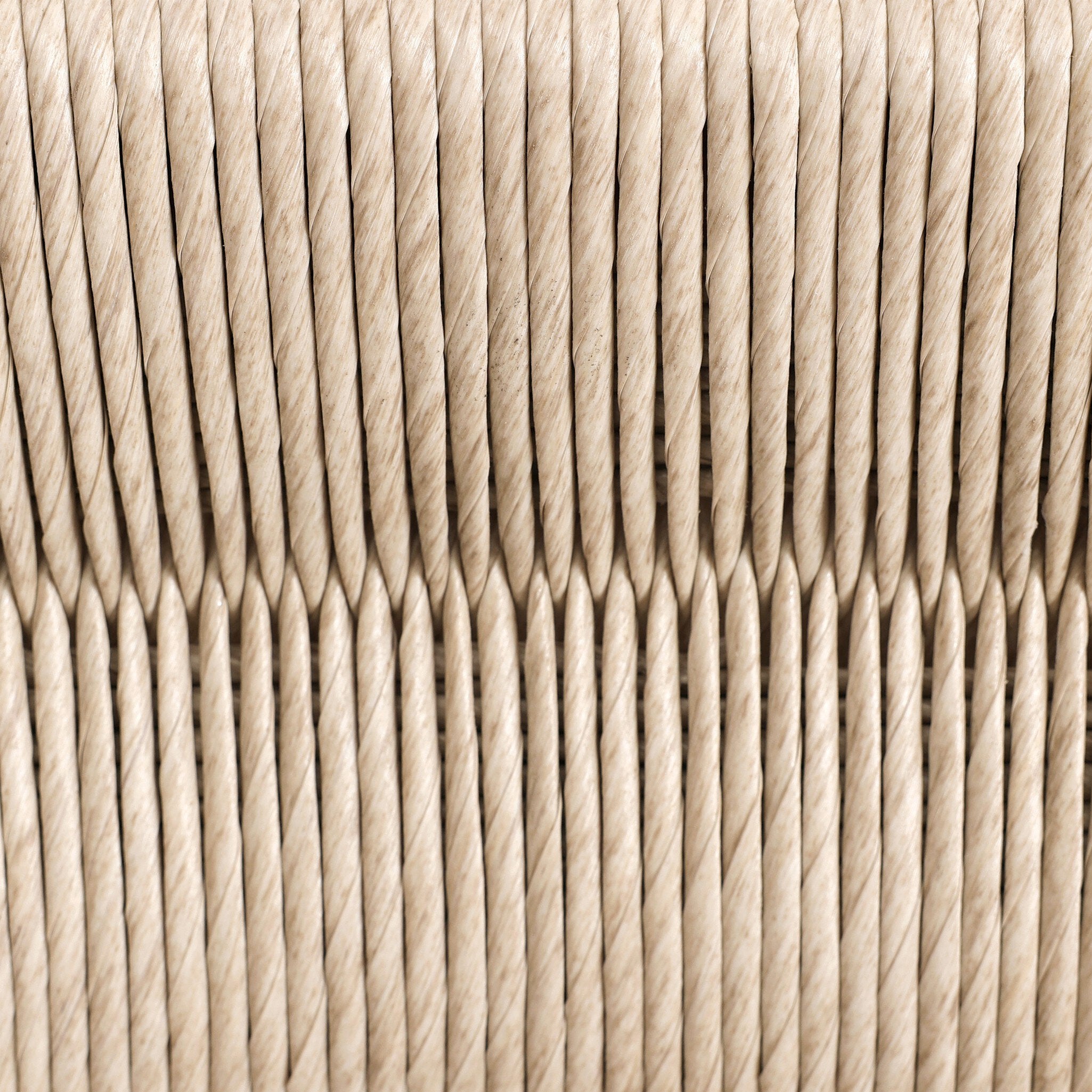 Outdoor bar stool backrest detail with vintage white rope weave