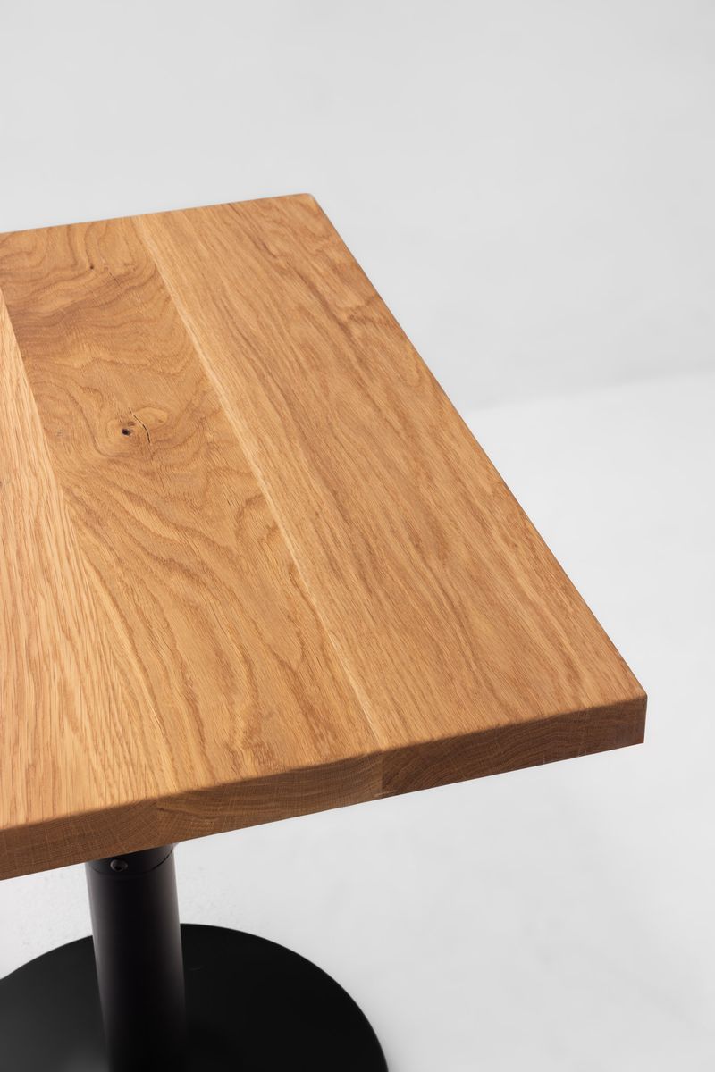White oak table top with visible wood grain and thick squared edge