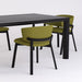 Editor side chair with green upholstered seat and backrest, black legs