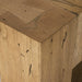 Close-up corner detail of Abaso accent bench showing dovetail joinery construction and rustic wormwood oak finish with natural wood grain and weathered markings.