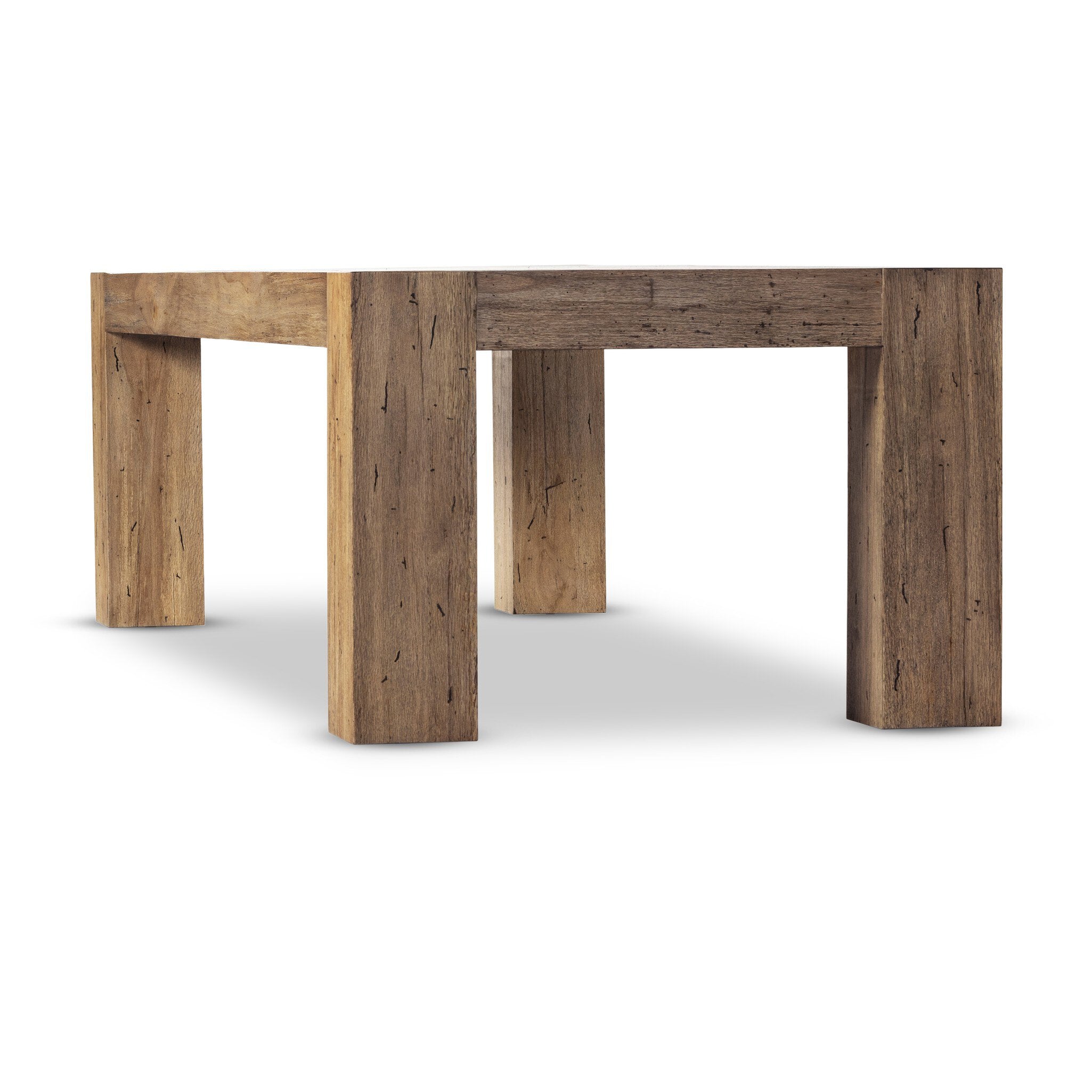 End view of Abaso rustic wormwood oak dining table showing chunky squared leg construction.