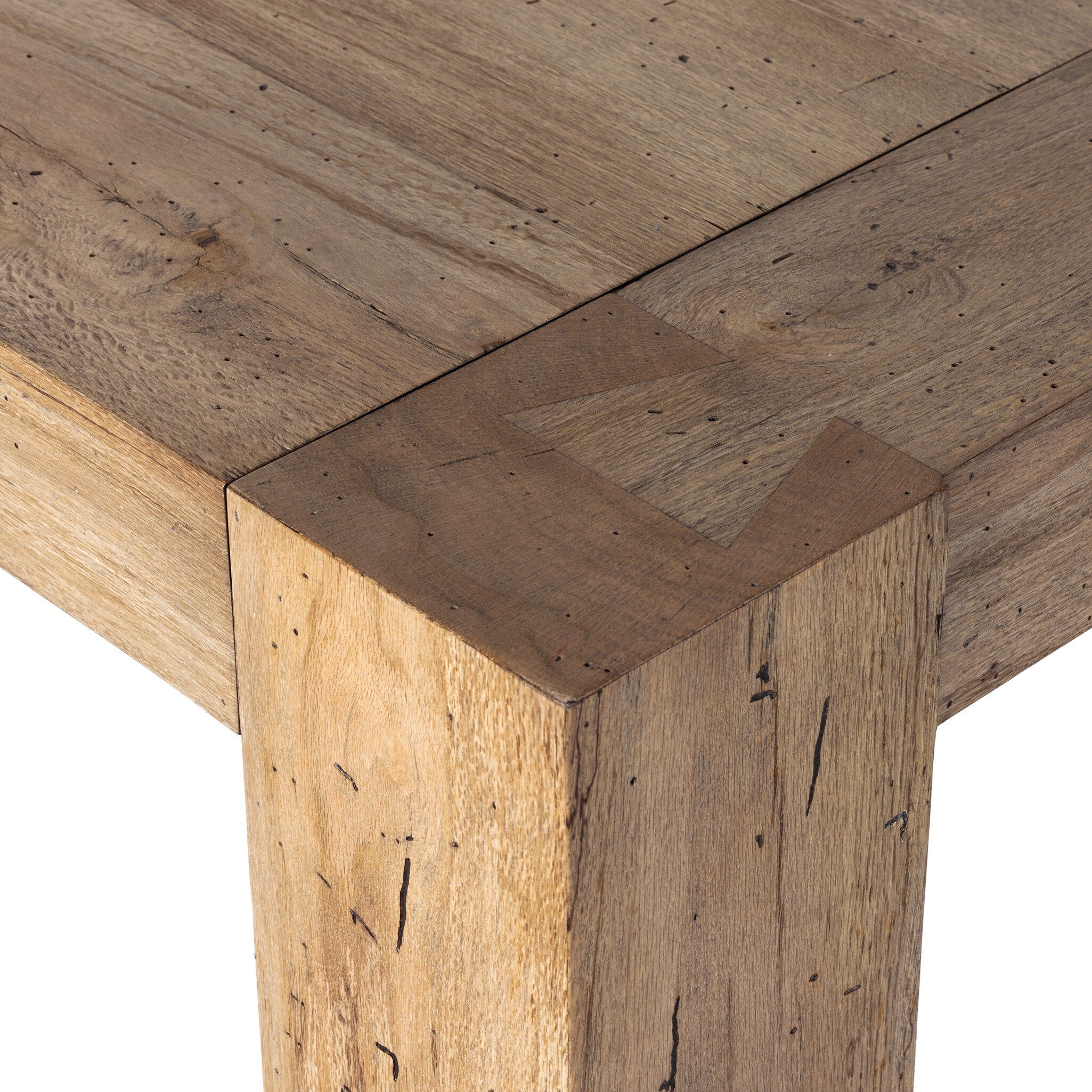 Three-quarter view of Abaso rustic wormwood oak dining table, 108 inches wide, seats 10.