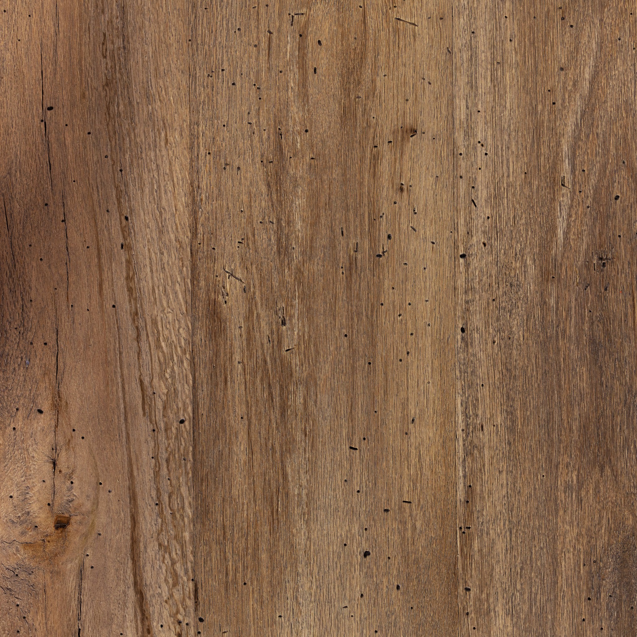 Close-up detail of rustic wormwood oak wood grain finish on Abaso dining table surface.