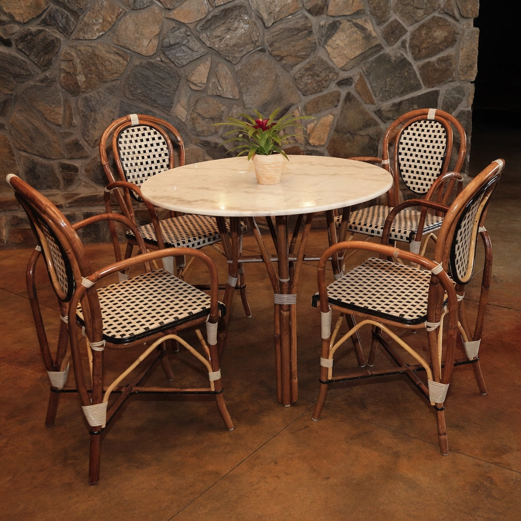 Set of four side chairs with warm brown wood frames and woven black-and-white seats
