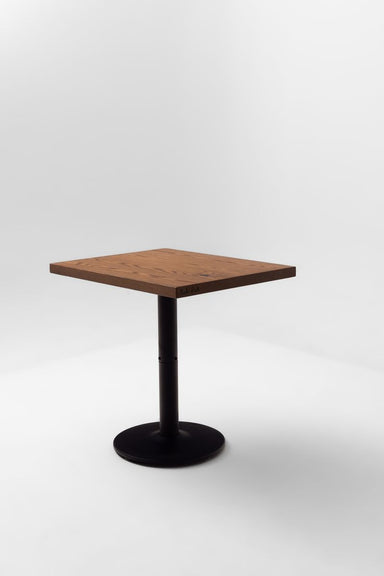 Square red oak tabletop on a black pedestal base