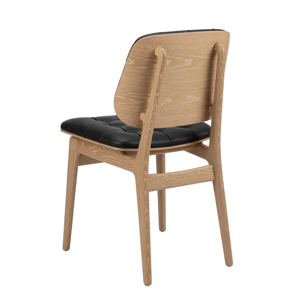Sutton side chair with black padded seat, light natural wood back panel and legs