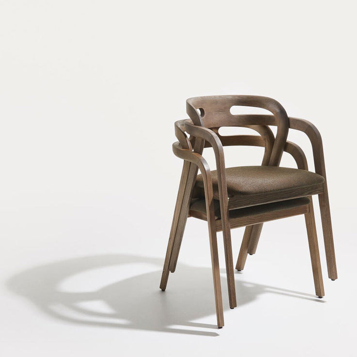 Natural wood arm chair with beige fabric seat and curved open back