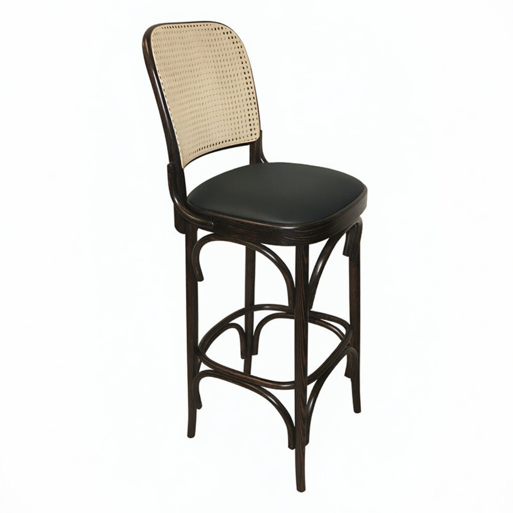 Theo bar stool side view with beige woven back, dark round seat, and curved footrest