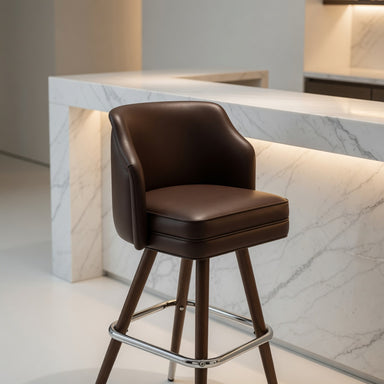 Dark brown leather-look bar stool with padded seat and curved back, on wood legs with chrome base