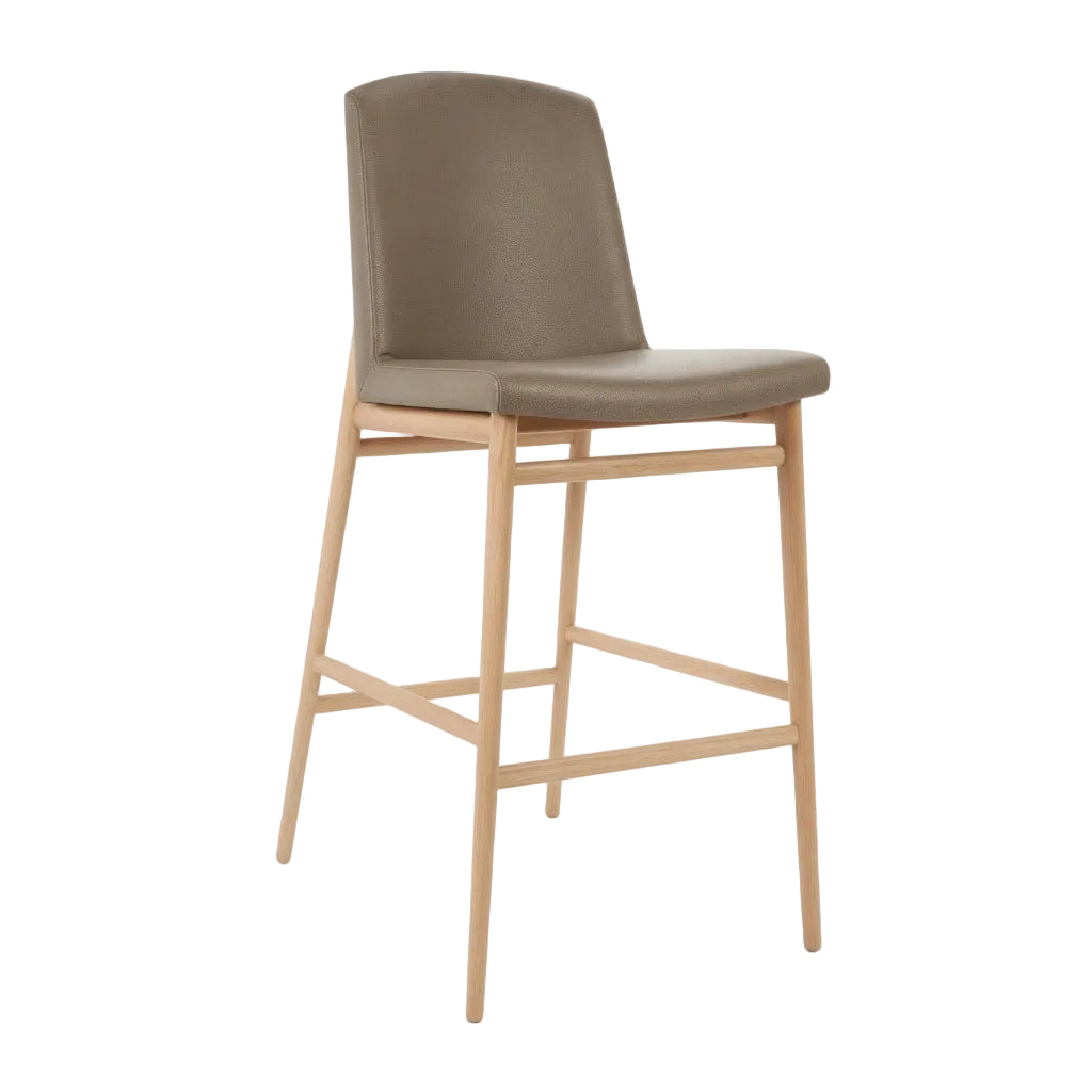 Bar stool with taupe upholstered seat and back, light wood frame and footrest bar