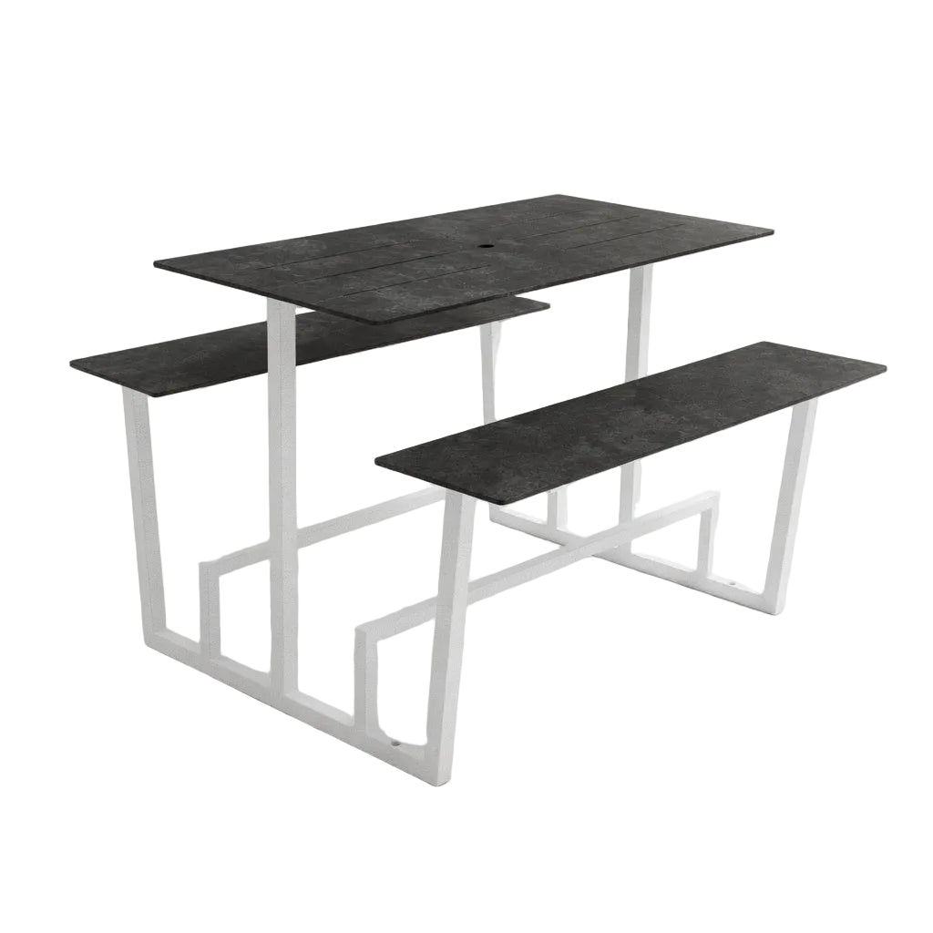 Monterey table with dark concrete top and white metal base, featuring two side benches.