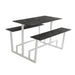 Monterey table with dark concrete top and white metal base, featuring two side benches.
