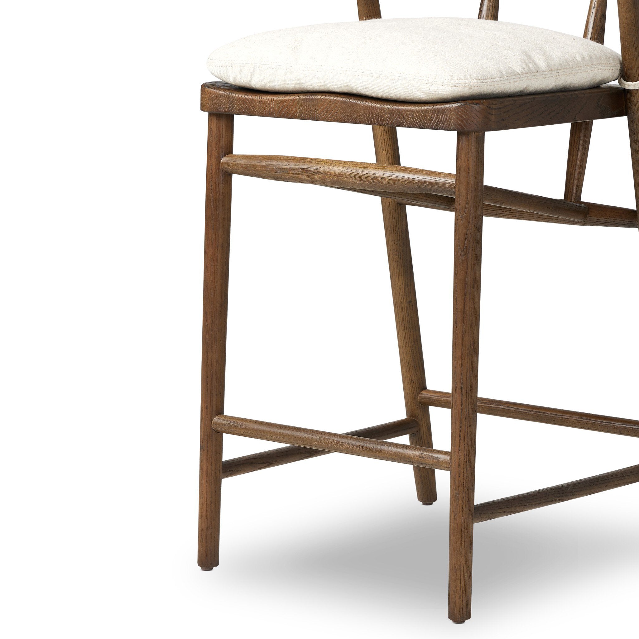 Leg detail Buxton Bar Counter Stool in solid ash with a hand-wrapped paper rush backrest