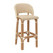 Rattan bar stool with rounded back, light woven seat in cream with small dark pattern