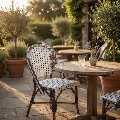 Outdoor side chair with white-and-blue woven seat, arched back, and wooden frame