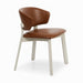 Editor side chair with brown upholstered seat and backrest, white angled legs