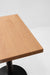 Maple table top with visible wood grain and thick squared edge, shown at an angle