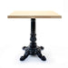 Ornate cast table base with fluted pedestal and three curved claw feet, black finish
