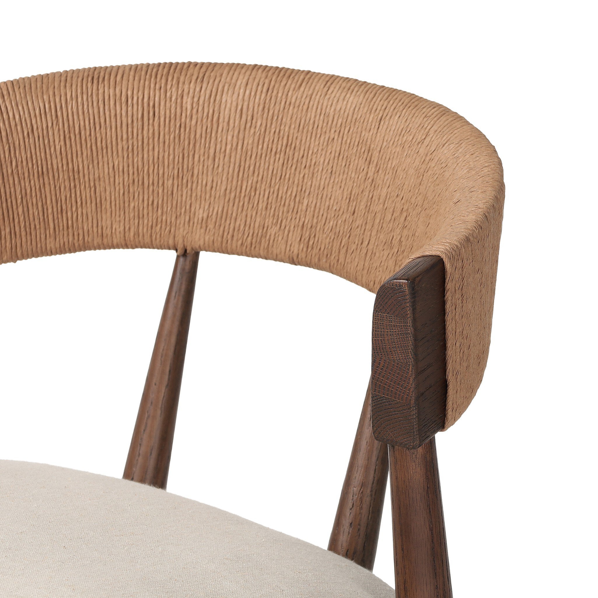 Woven seat detail Buxton Armless Dining Chair in solid oak with a hand-wrapped paper rush back and Savile Flax seat