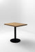 Square ash table top on black pedestal base, natural wood grain finish
