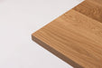 Corner view of white oak table top showing smooth rounded edge